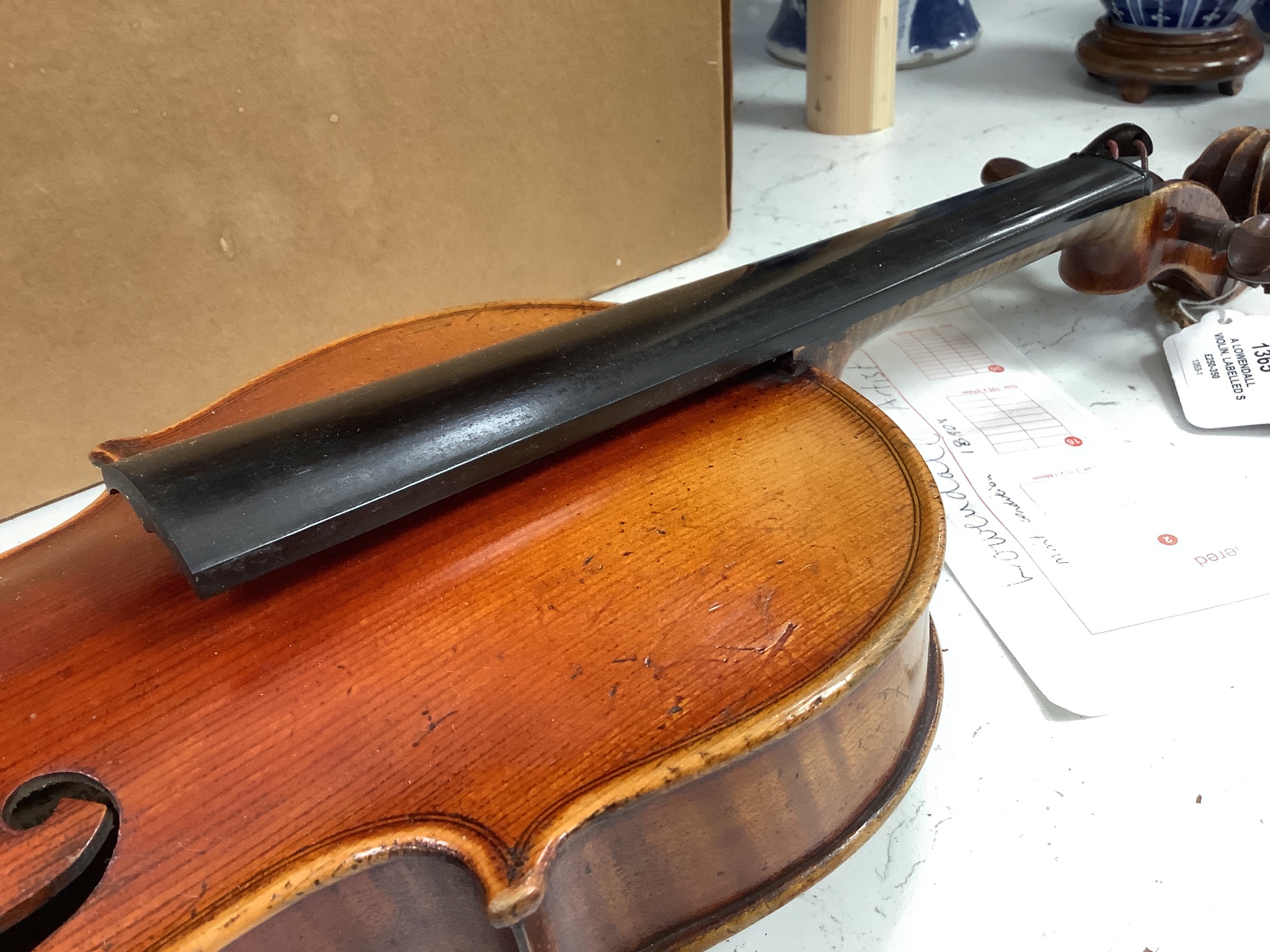 A Lowendall violin, labelled Stradivarius, 58cm long, together with a bow